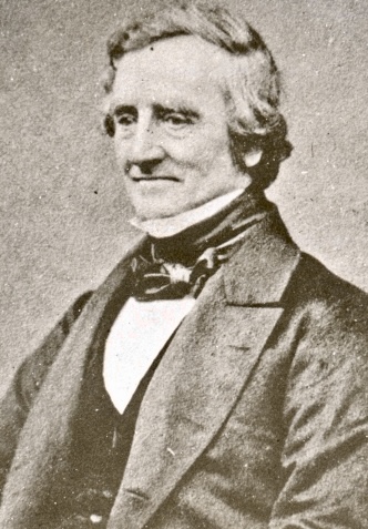 Photo of James Watson. Middle aged man in Victorian clothing.